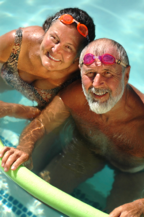 Senior couple swimming together
